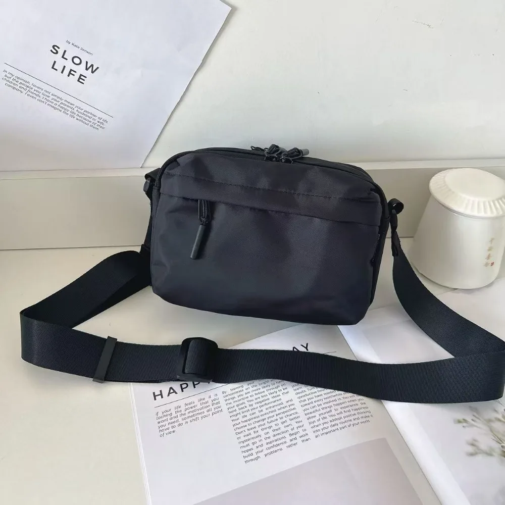 

Waterproof Oxford cloth black lightweight casual shoulder bag for men and women's mobile phone shoulder bag