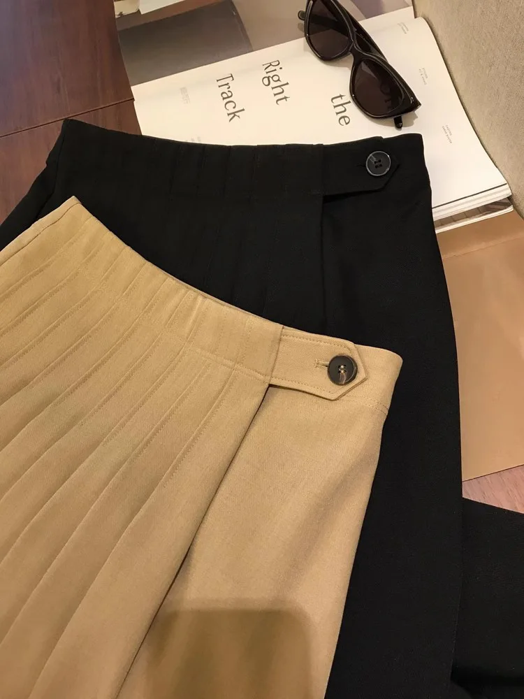 Primavera e outono feminino casual cor sólida cintura alta plissada saia de meio comprimento