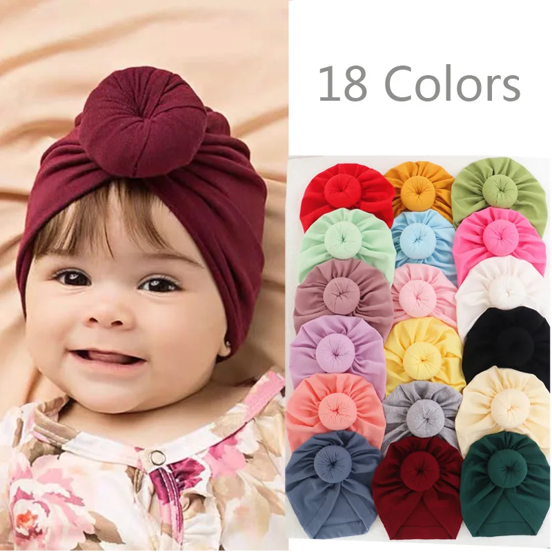 Solidna bawełna pączki Baby Boy dziewczyny czapka z daszkiem 0-2T słodkie nowonarodzone Skullies czapki miękki turban indie Topknot Headwraps