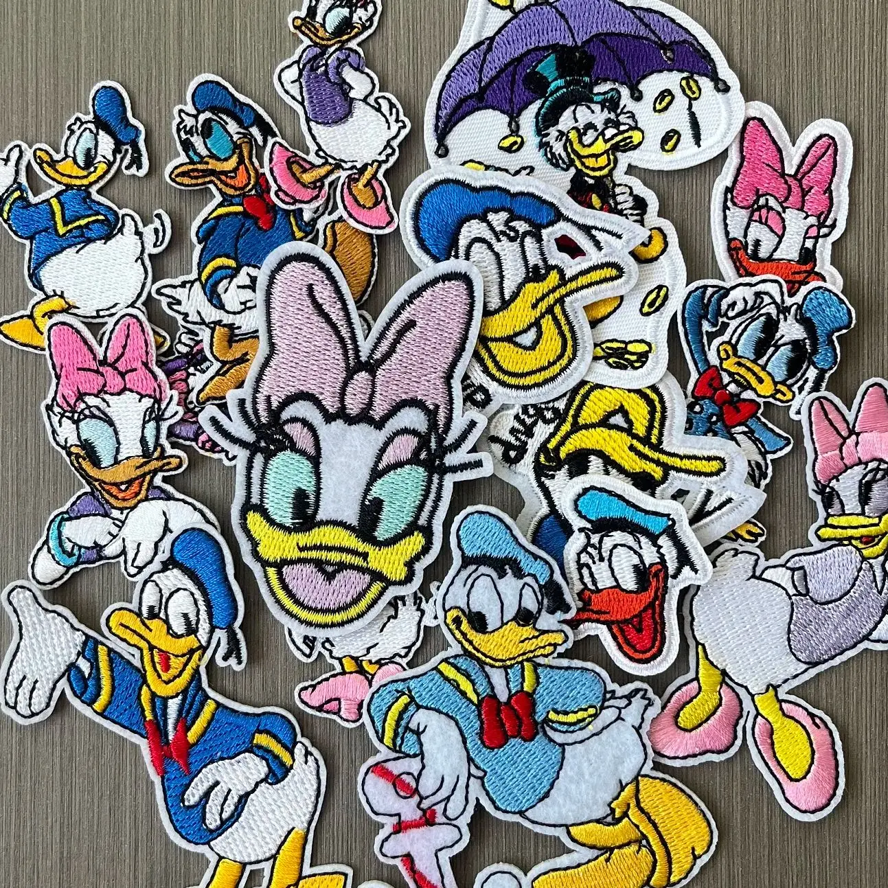 

16Pcs Cute Cartoon Disney Donald Duck Daisy Duck Iron on Embroidery Patches for Sew Child Clothing DIY Jeans T-Shirts Appliques