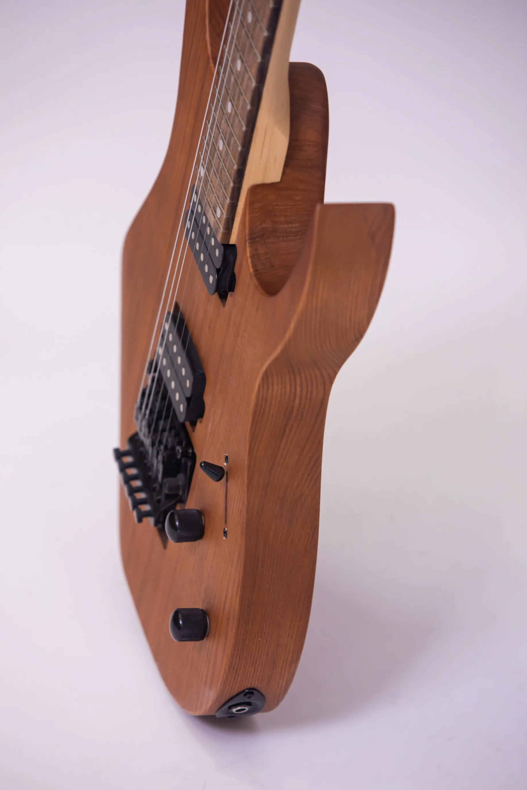 Custom-made model, the body has a cut-out, the pickups are double, single and double, the fretboard is with a floral pattern