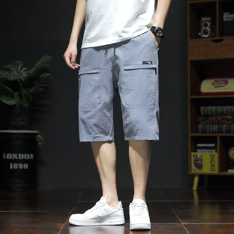 Summer New Fashion Casual Versatile Loose Beach Shorts Men Elastic Waist Drawstring Pockets Big Size Sports Straight Short Pants