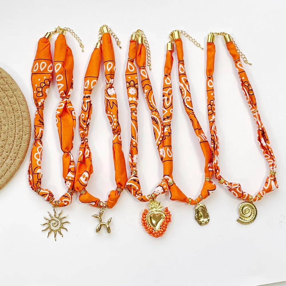 

Orange Bandana Necklace with Stainless Steel Charm Boho Scarf Choker with Sun, Balloon Dog, Heart, Shell Pendant