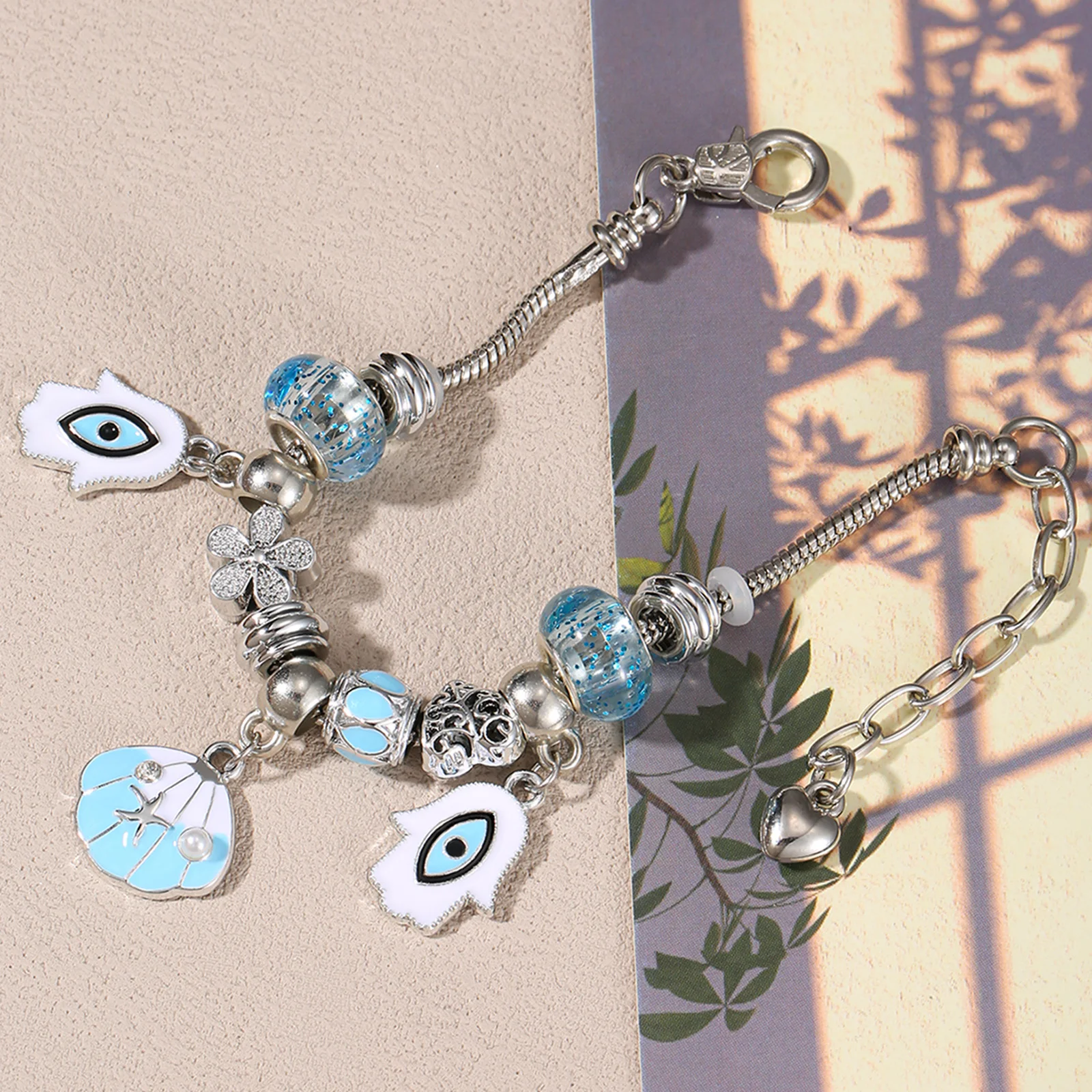 

Silvery Tone Stainless Steel Pandora-Style Charm Bracelet with Evil Eye and Shell Charms for Women