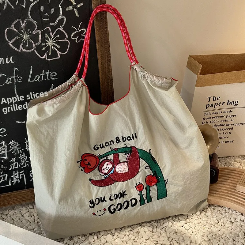 bolsa-de-ombro-de-lona-com-bordado-de-aco-ecologico-bolsa-de-ombro-de-ande-capacidade-para-mulheres-estilo-doce-e-legal