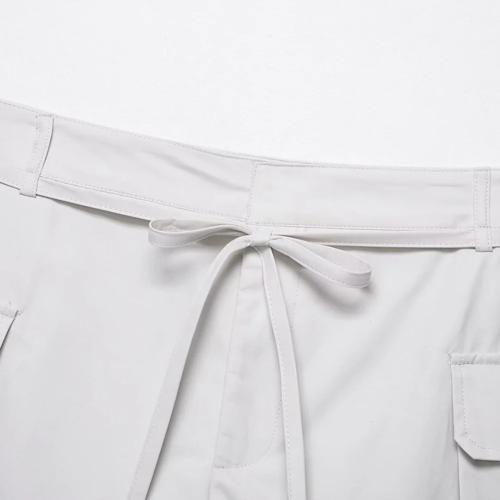 سروال نسائي بلون سادة برباط للعمل مع جيب متوسط الخصر مزين للصيف شورت عصري متعدد الاستخدامات