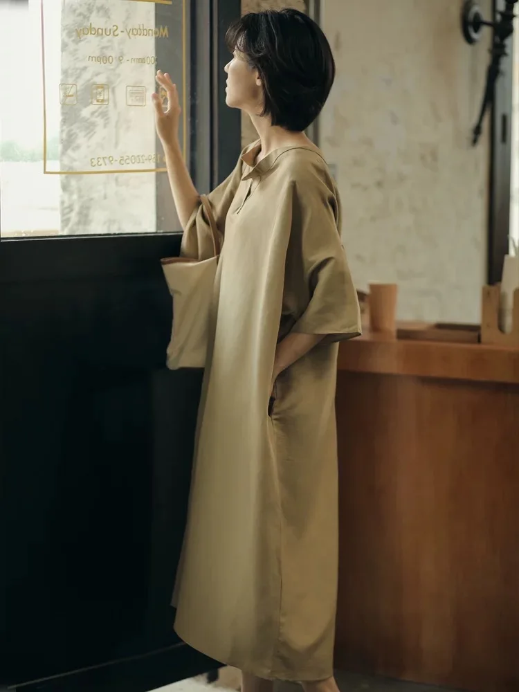 プラスサイズの女性のファッショナブルな半袖ストレートドレス夏 2025 ルーズおなかカバー痩身ドレス A ラインガウン