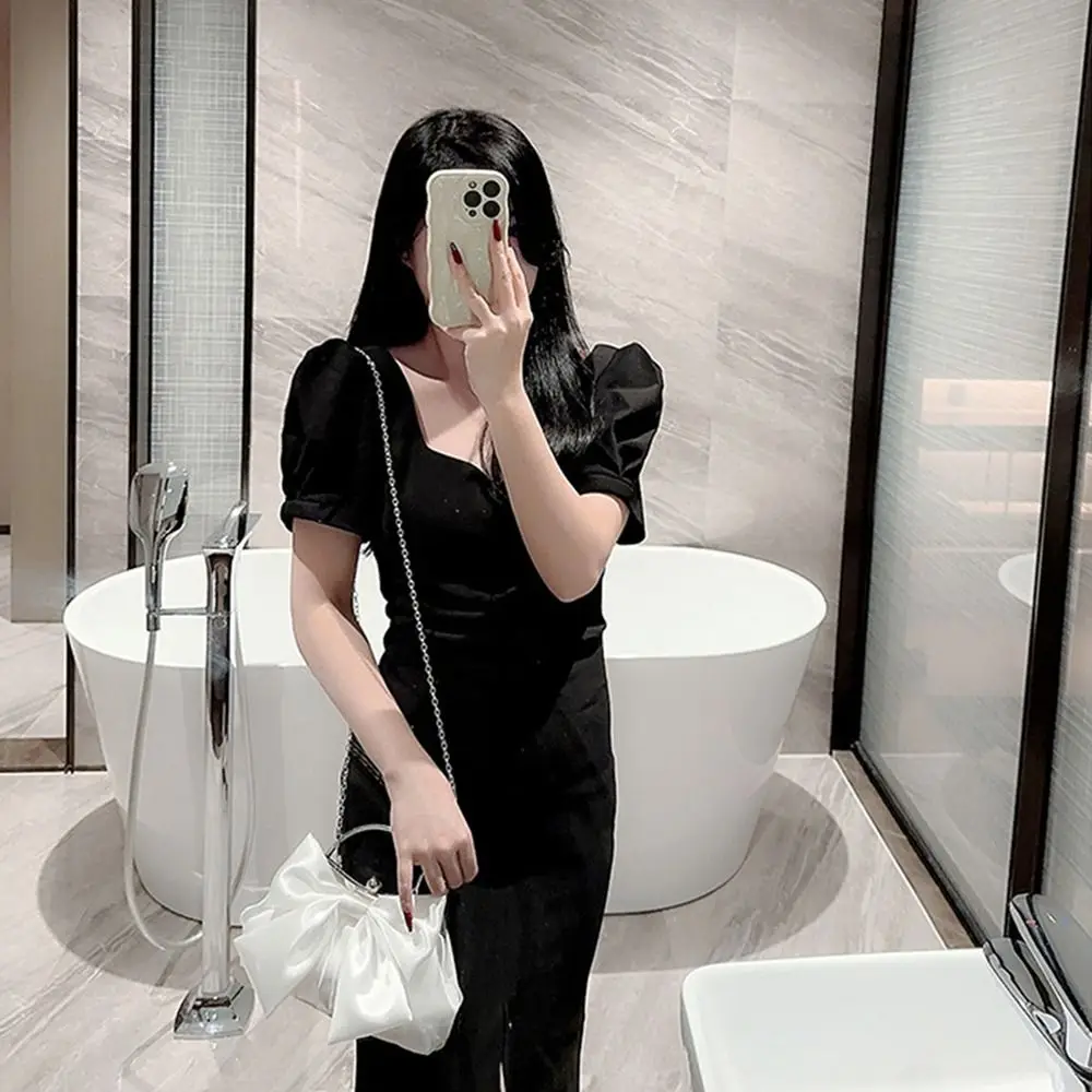 Рисунок 2 - Золотая яркая шелковая вечерняя сумка с бантом