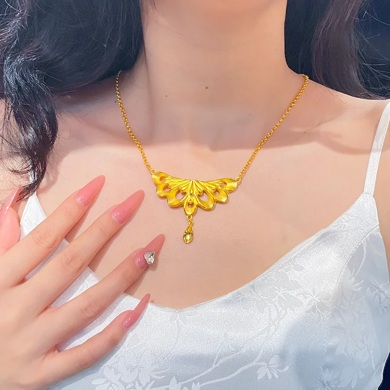 9999 gold hollowed-out peacock tail drop necklace for women. Luxurious and niche wedding jewelry for sale.
