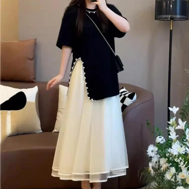 Plus size two-piece women's summer fashion is slim and covered with meat. Summer dress is short-sleeved shirt+overskirt suit.