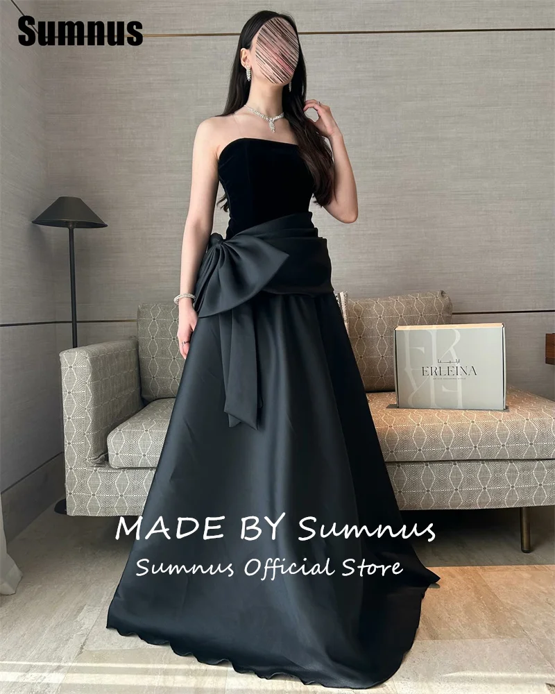 فستان Sumnus الحديث على شكل حرف a للحفلات الراقصة بدون حمالات أسود بدون أكمام طيات فيونكة فساتين رسمية طول الأرض فستان سهرة 2025 مخصص