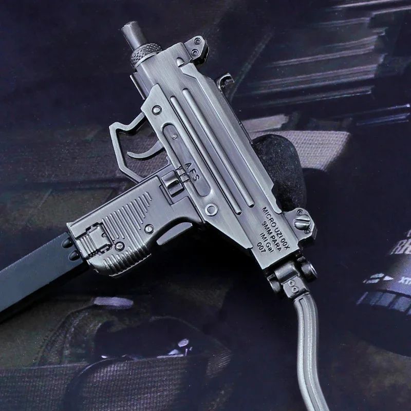 Colgante de pistola submetralétrica modelo UZI en miniatura de aleación de 15CM, llavero de pistola de alta calidad, colgante artesanal, arma falsa, regalos para niños