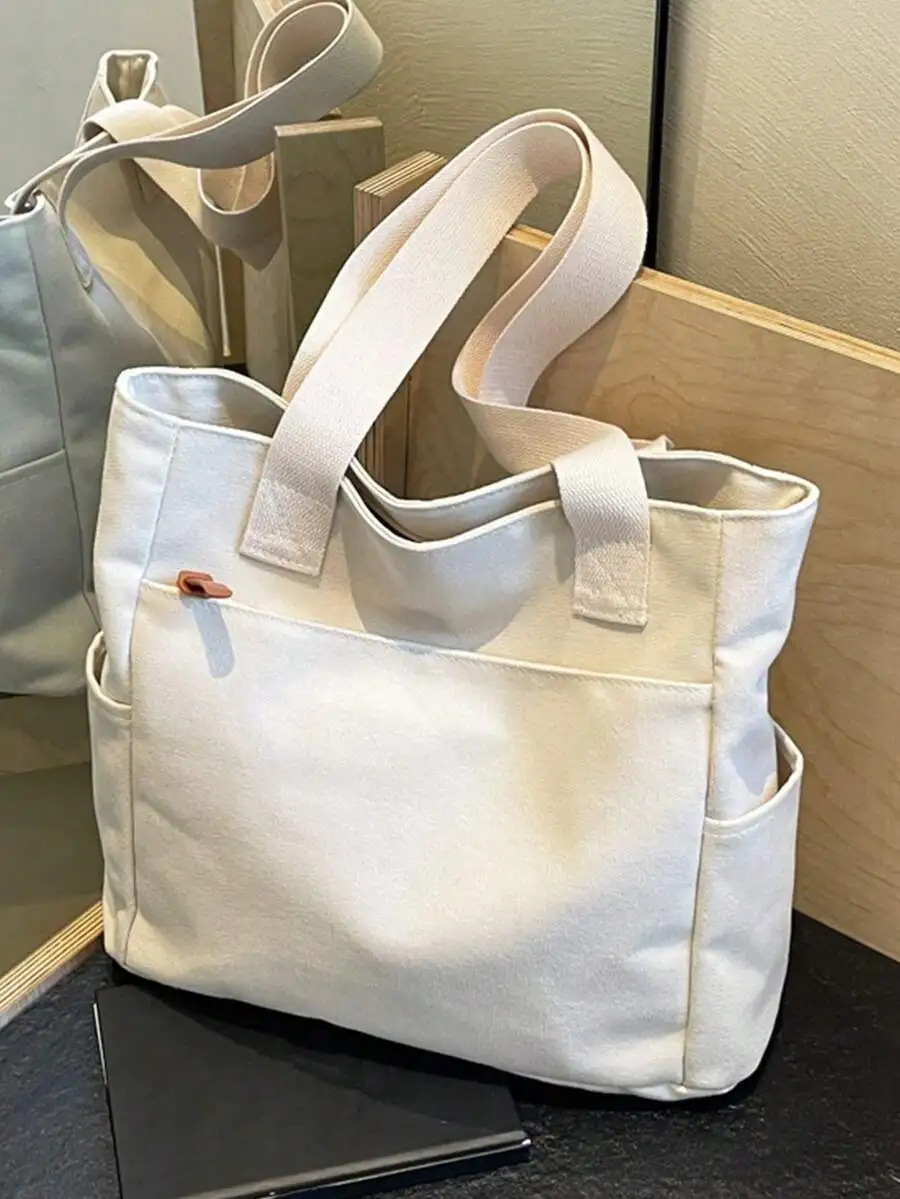 

Кремовая холщовая сумка-тоут с множеством карманов, верхней ручкой и боковыми отделениями для повседневного использования