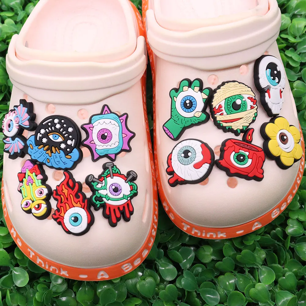 Mix 50pcs PVC Shoe Charms Horrible Eye Flower Candle Mushroom Fire Hand Hole Slipper Decoration Accessories Fit Wristbands