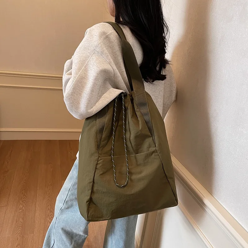 Light casual women's bag draw rope mouth large capacity simple multi-functional hand lashable shoulder backpack