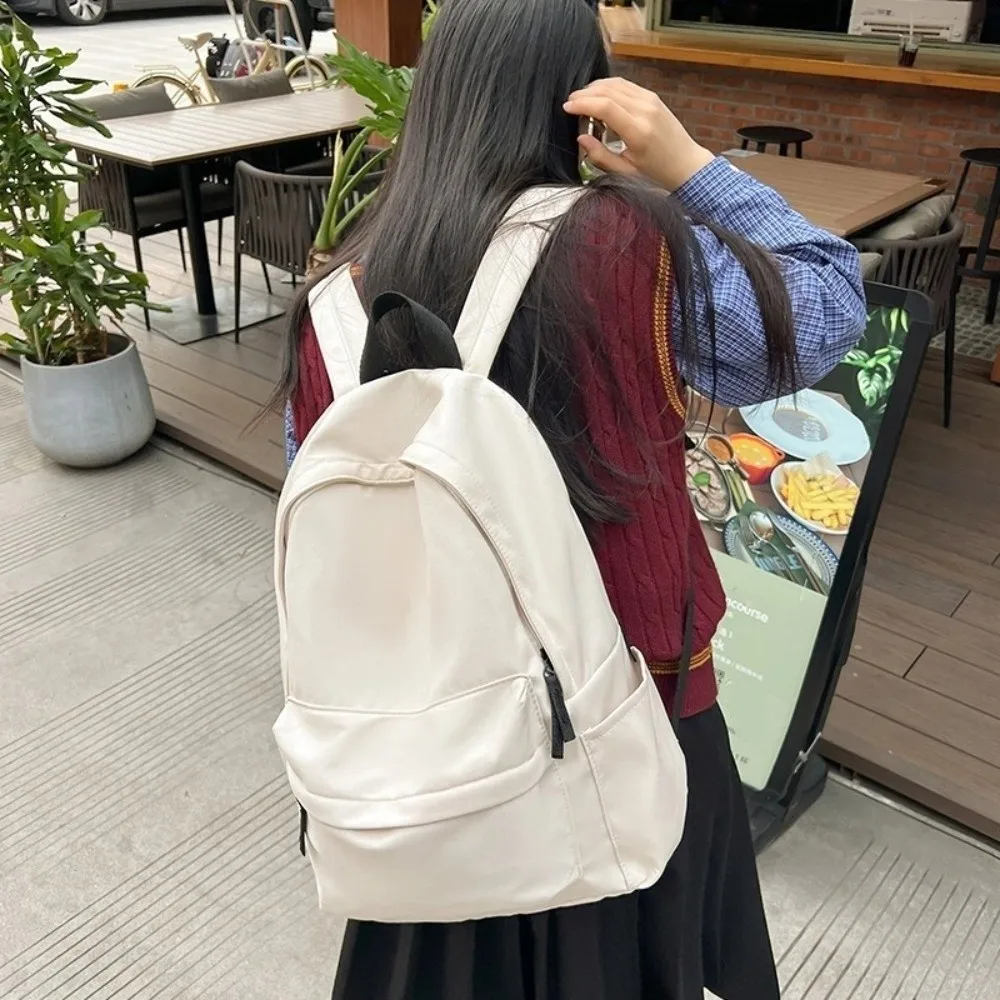 Tas Ransel Siswa Modern Kapasitas Besar Bahan Nylon Kasual Warna Solid Tali Dapat Disesuaikan Tas Travel Sekolah