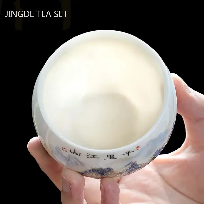 Exquisita taza de té de porcelana blanca de Jade gordo de cordero, taza de té de cerámica portátil hecha a mano, juego de té personalizado, taza