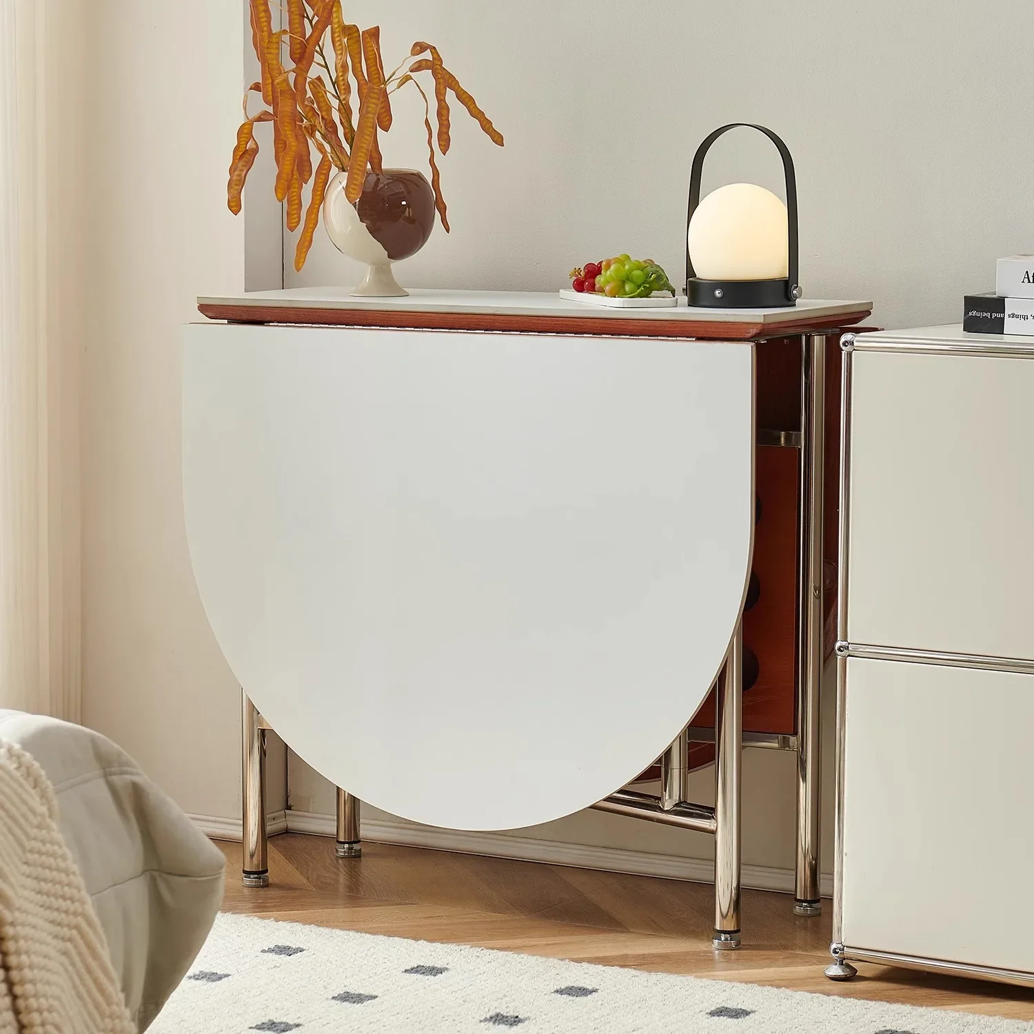 طاولة بيضاوية من الفولاذ المقاوم للصدأ قابلة للطي على الطراز الشمالي، طاولة تخزين بسيطة على طراز القرون الوسطى مقابل الحائط