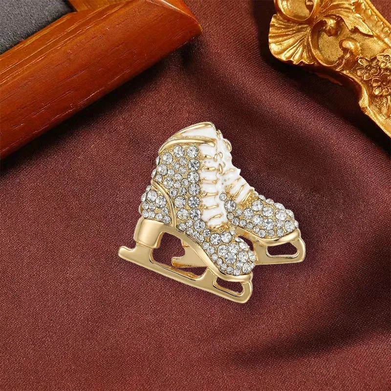 Cross border diamond inlaid enamel drip oil jewelry fashion Christmas ice skates brooch temperament versatile suit chest flower