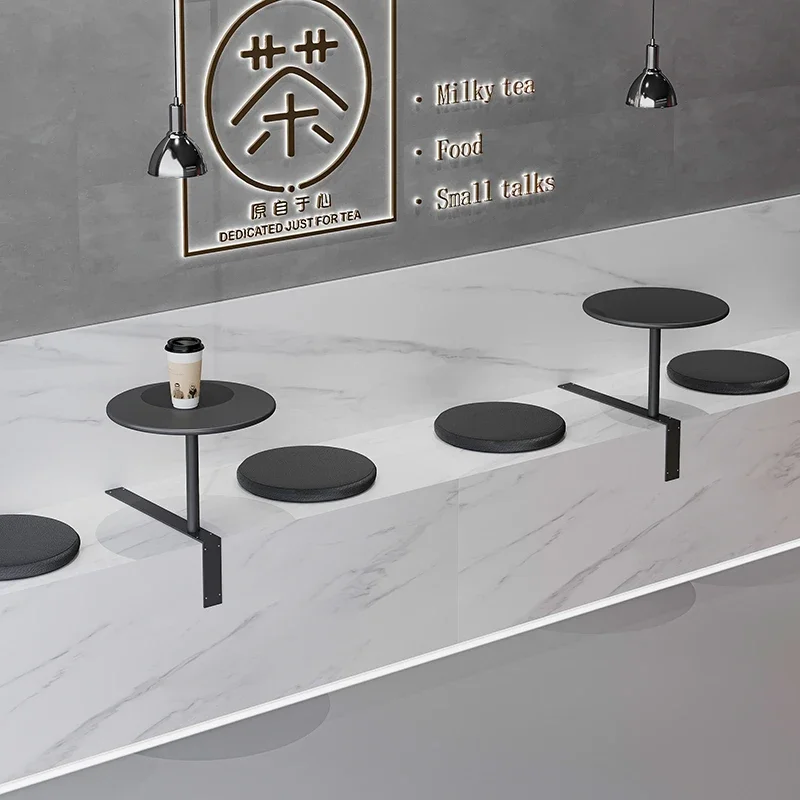 

Nordic coffee shop table by wall, simple modern HEYTEA milk tea shop wall cement small round dining table customization