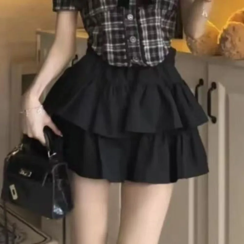 Novedad de verano, ropa de té pequeña a la moda, camisa de manga de burbuja a cuadros, Falda corta de pastel negro, traje pequeño de dos piezas de viento fragante para mujer