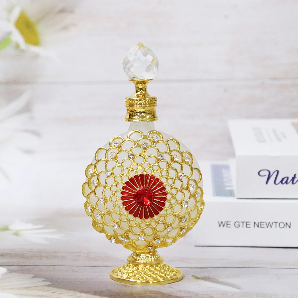 Luxurious handcrafted rhinestone and painted perfume bottle with Middle Eastern Dubai style, suitable for holding essential