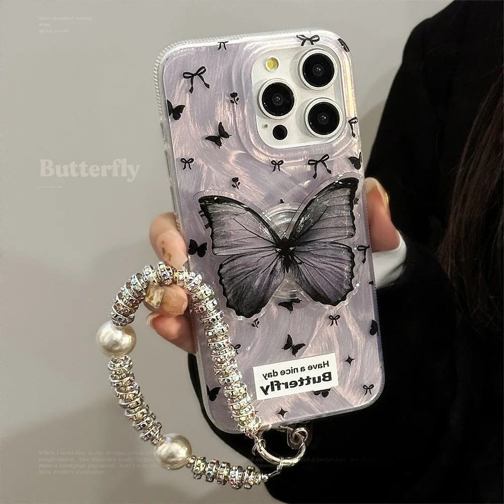 Luxuriöse schwarze Schmetterlings-Halterung für iPhone 17, Air 16, 15, 14, 13, 12, 11 Pro Max, mit Handgelenkkette, stoßfeste Hartschale
