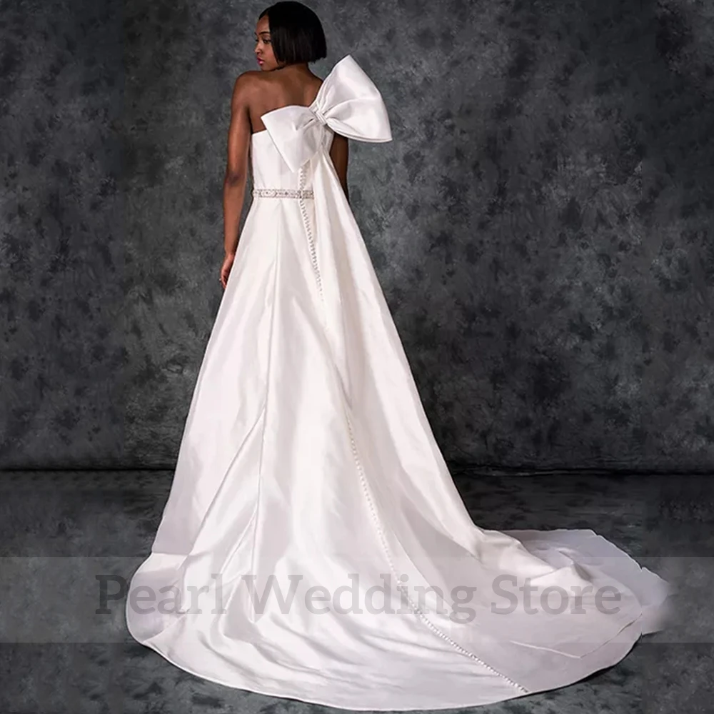 Charming One Shoulder Sleeveless Wedding Dress with Bow Sexy Open Back Bridal A-Line Floor Length Sweep Train Belt Bride Gowns