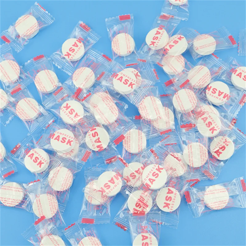 20/50/100PCS Disposable Compressed Facial Mask Non-woven Face Mask Facial Towel Coin Cotton Wrapped Tissues For Beauty Salon