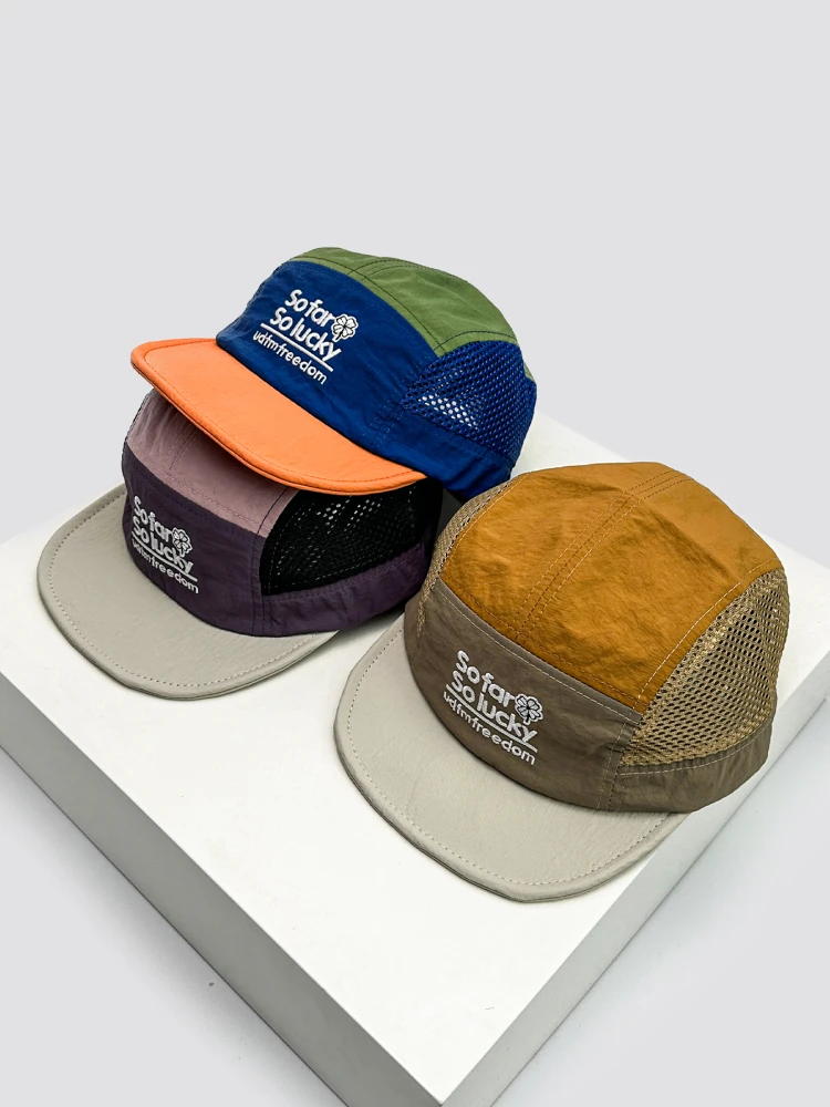 

Spring and summer new quick-drying embroidered letter baseball cap men's and women's sunshade mesh eye flat brim travel cap