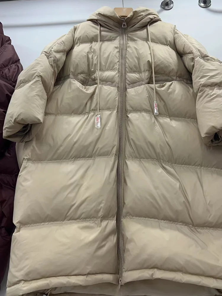 Inverno com capuz cordão solto puffer jaqueta feminina sólida oversize casual silhueta longo pato branco para baixo casaco quente 2024 novo casaco