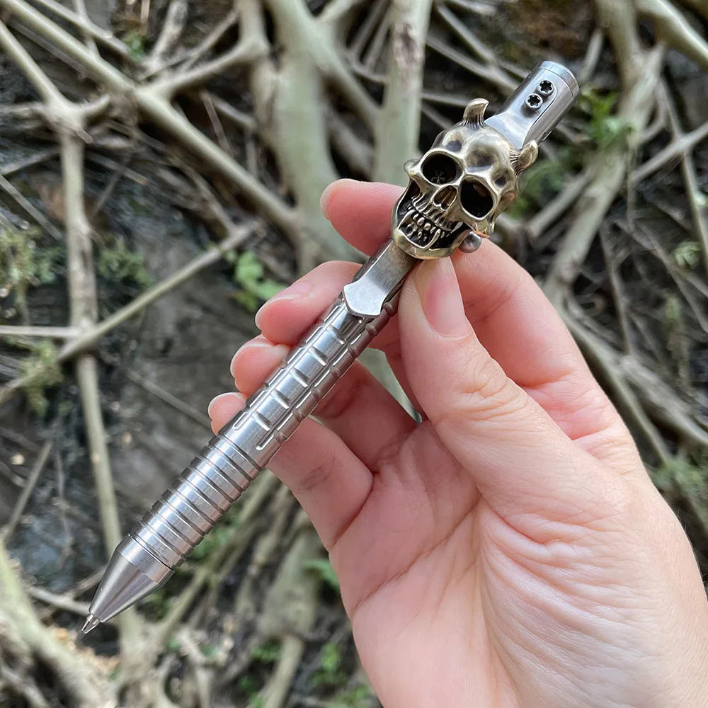 

EDC шариковая ручка из нержавеющей стали, раздвижная металлическая ручная работа, карманный зажим с черепом, письменные принадлежности на открытом воздухе, деловые канцелярские принадлежности