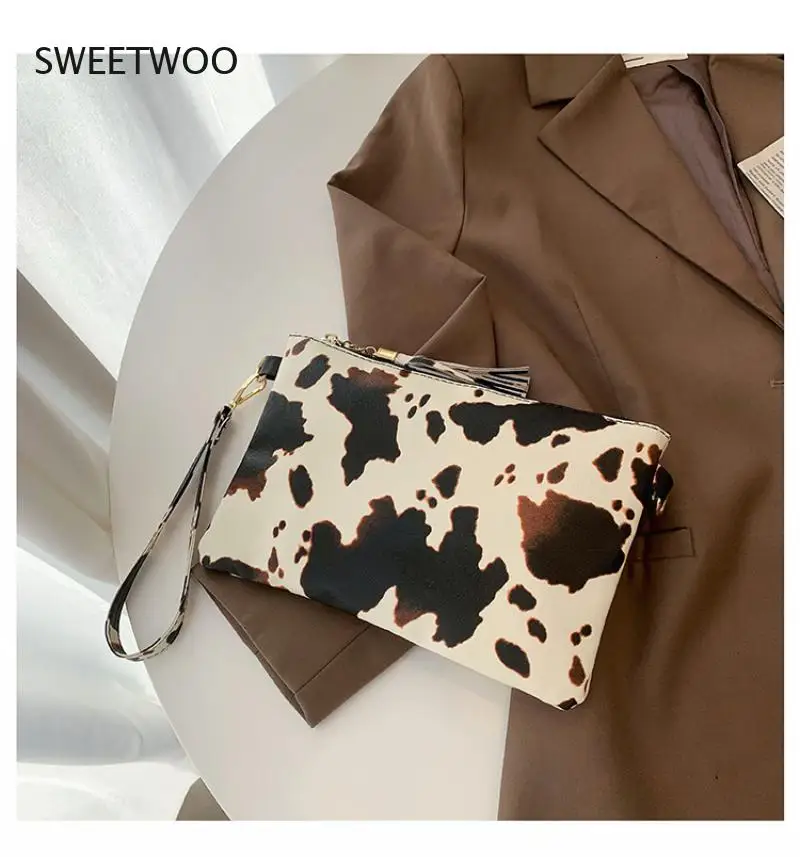 Borsa da polso geometrica con stampa di mucca leopardata in pelle PU borsa portaoggetti per telefono cellulare con moneta pochette da pranzo da donna