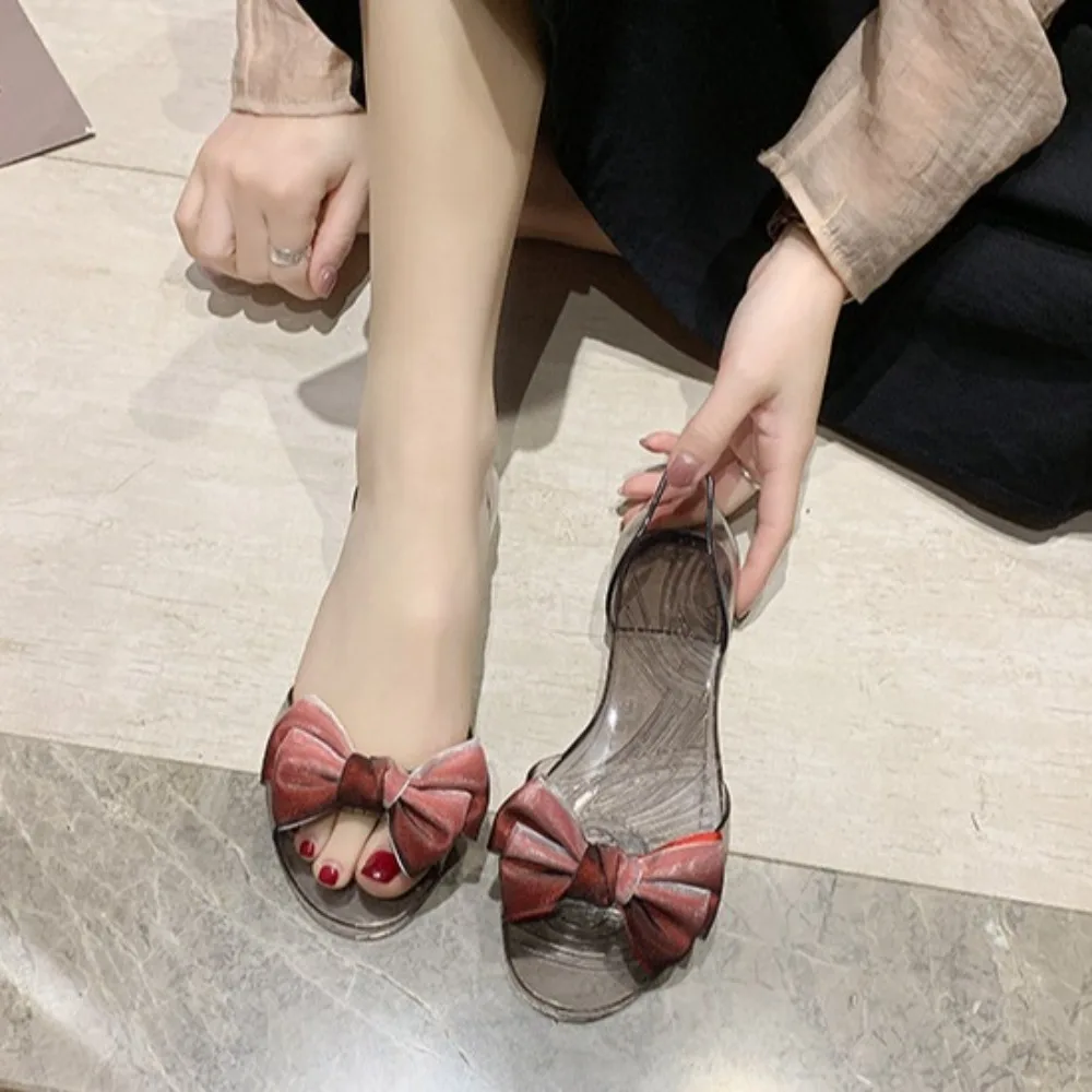 Повседневные тапочки, блестящие прозрачные сандалии, прозрачные шлепанцы, сандалии, нескользящие туфли на плоской подошве с бантом, женские летние туфли