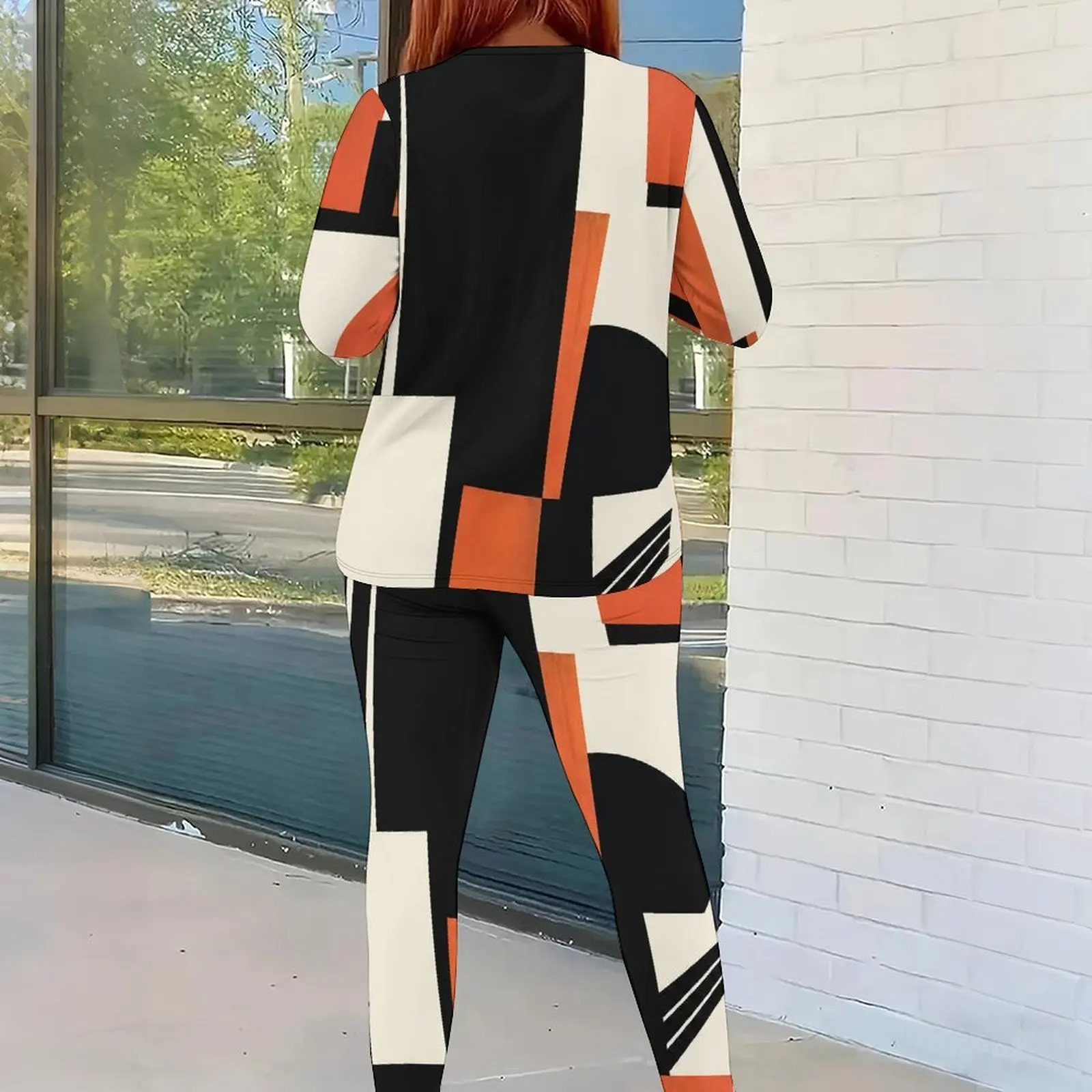 Women Geometric Black Orange White Color Block Printed Round Neck Long Sleeve Top and Fitted Pants Two Piece Set