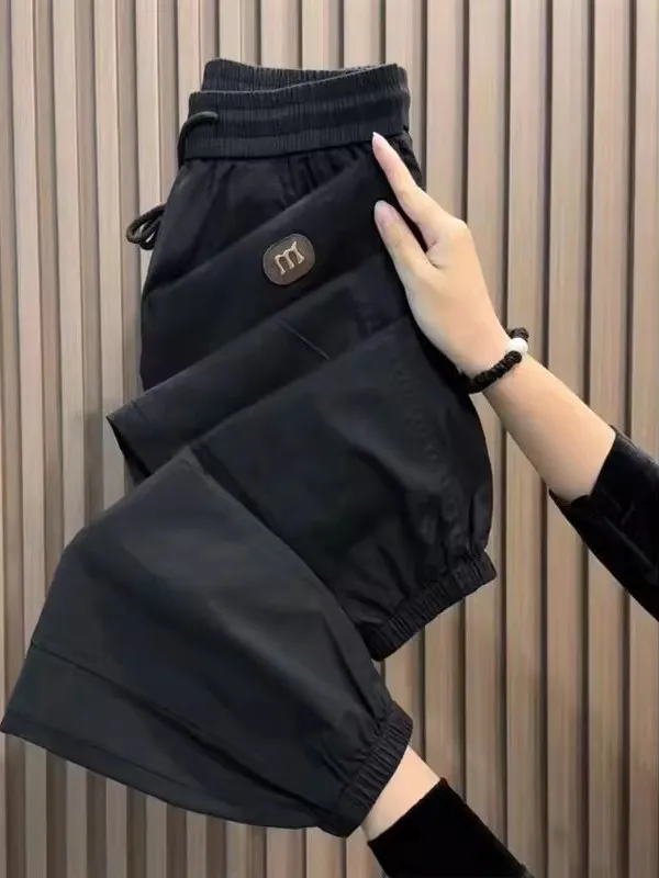 سراويل رجالية صيفية من الحرير الجليدي سريعة الجفاف غير رسمية فضفاضة تناسب الخصر المرن نمط هارلان تسعة نقاط كاكي اللون العلامة...