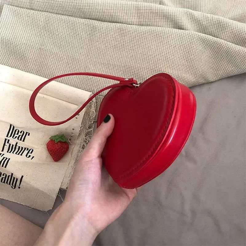 2024 North American PU Leather Solid Color Series Change Bag Cute Mini Hand Wrist carrying red heart-shaped wallet محفظة كروت