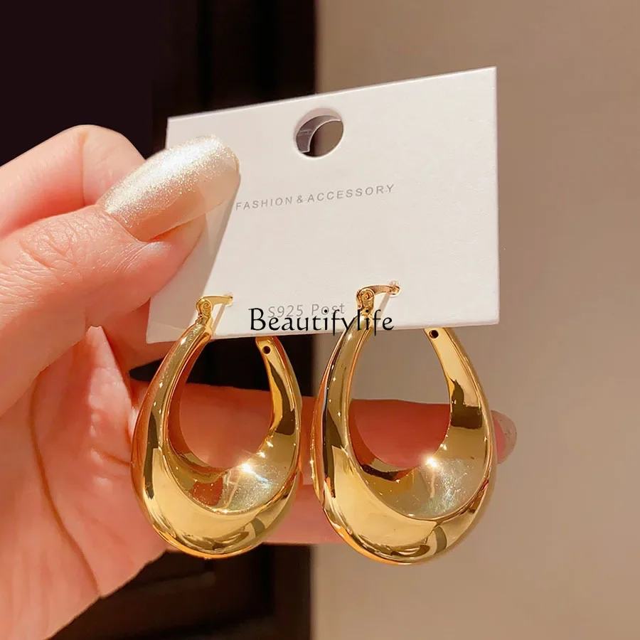 

High-end niche design metal hollow water drop ear buckle earrings retro Hong Kong style cold wind