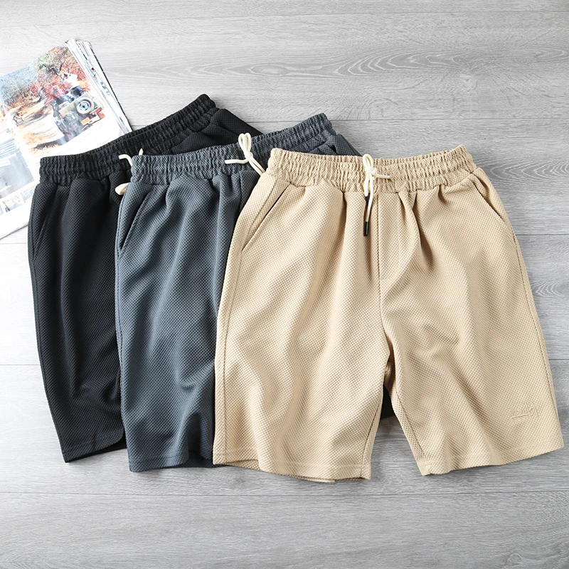 

Мужские летние шорты из плотной ткани с текстурой сосны, на эластичном поясе, свободного кроя, длиной до колена, модные