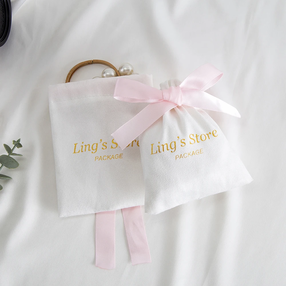 

50pcs Custom Logo White Jewelry Flannel Drawstring Bag Back Side with Pink Silk Ribbon Gift Packaging Pouch Wedding Candy Pocket