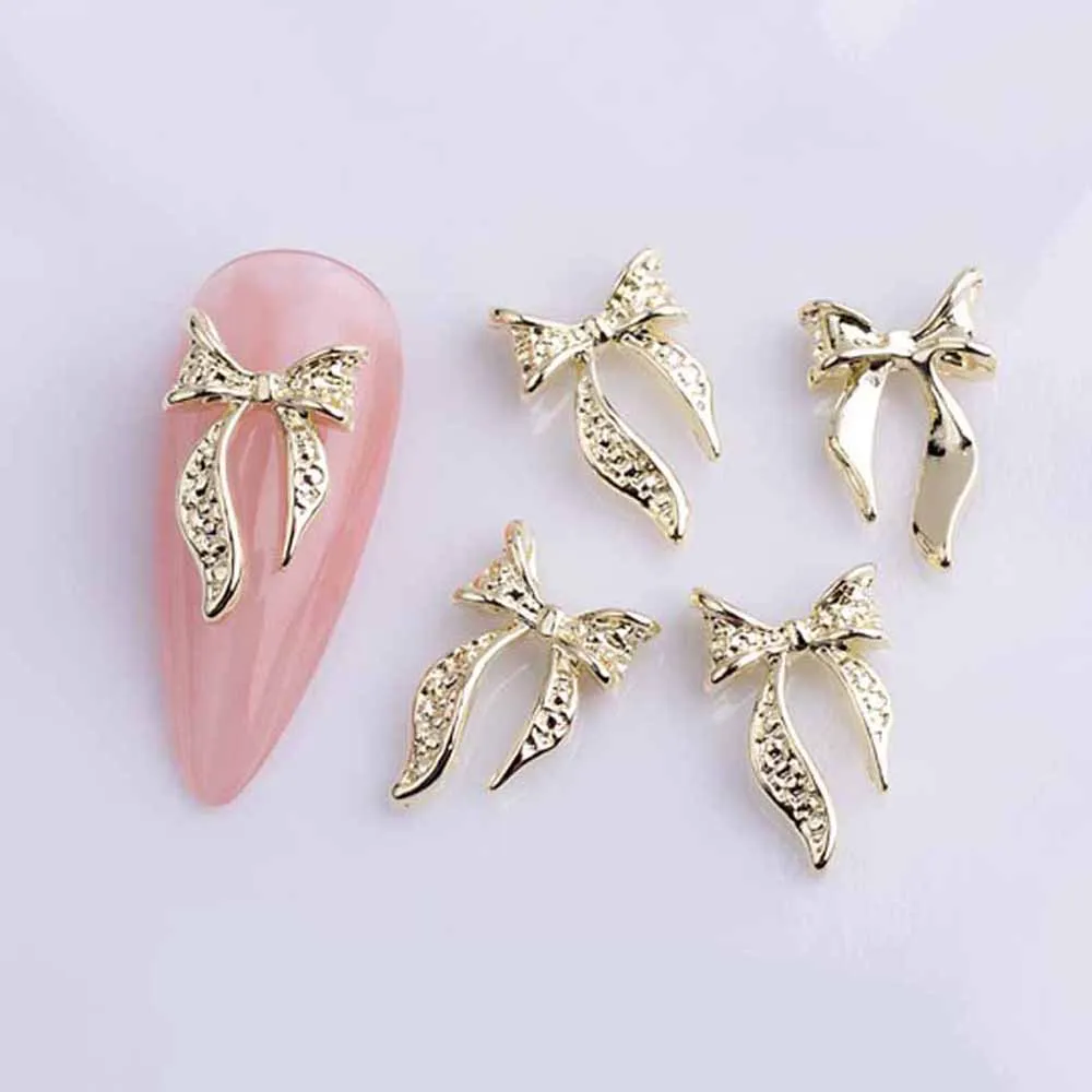 Nœuds de ruban en alliage pour Nail Art, breloque 3D or/argent, Mini nœud papillon creux, pièces de décoration d'ongles, bricolage, Design japonais, 20 pièces