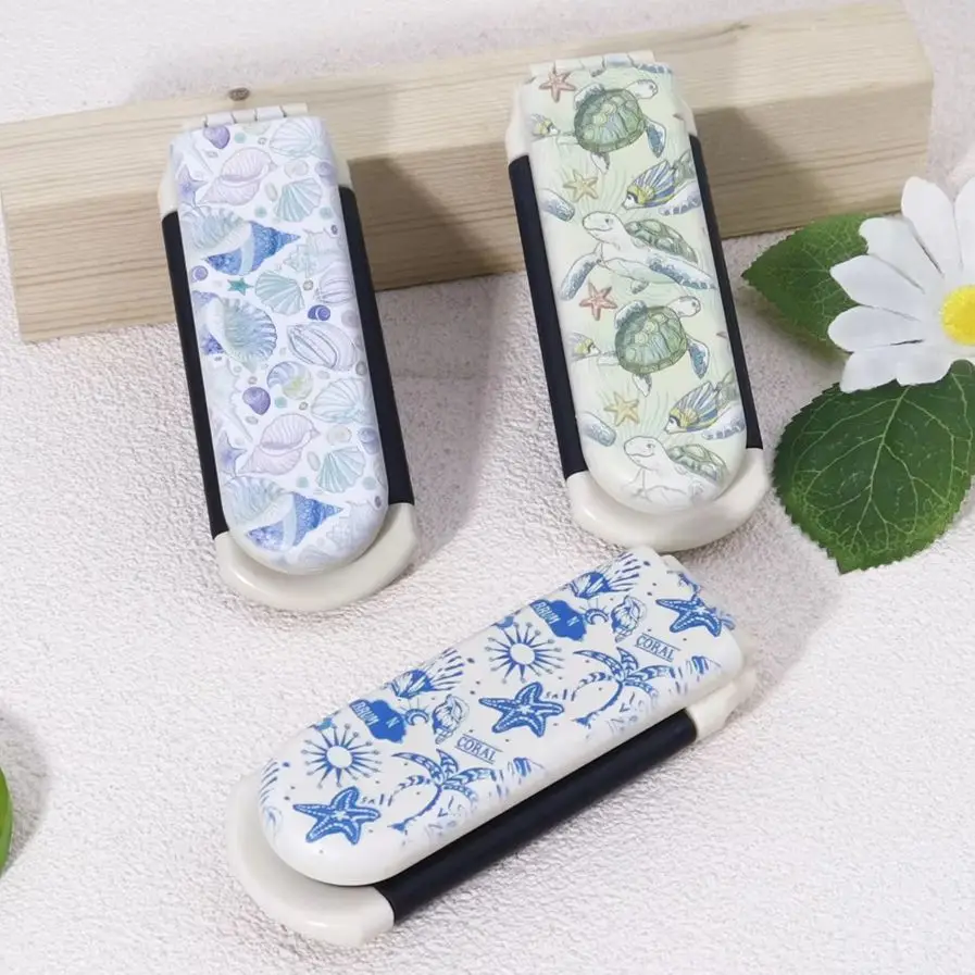 1pc オーシャンスタイルプリント折りたたみコーム - 帯電防止、ポータブルデザイン、優しいコーミングとスタイリング、本物の髪のかつらに特化