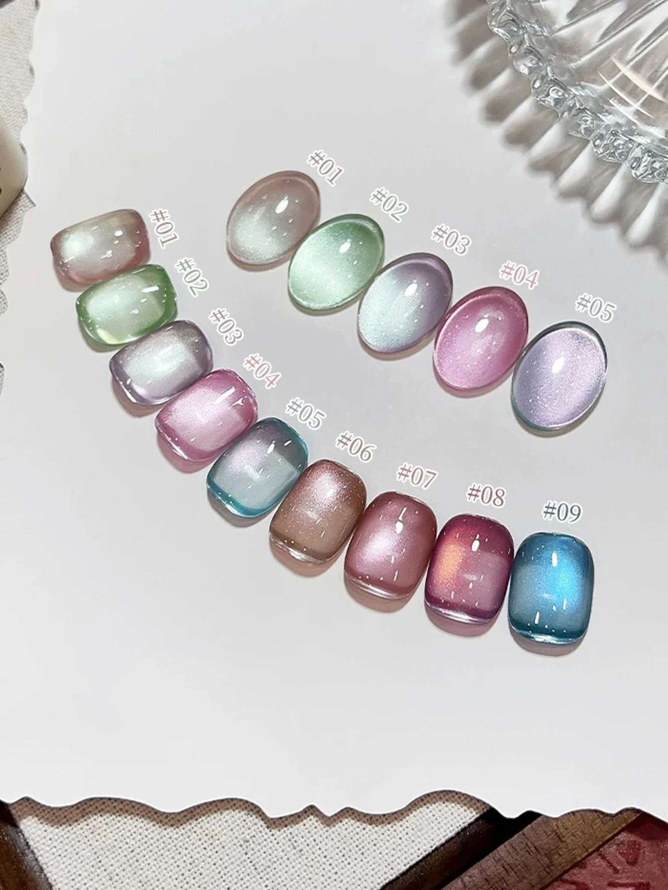 9PCS2025 جديد مسمار الفن موضة العلاج بالضوء الزجاج الخرز الصقيل الحلوى الملونة كريستال القط العين شفافة جيل طلاء الأظافر ، يدوم