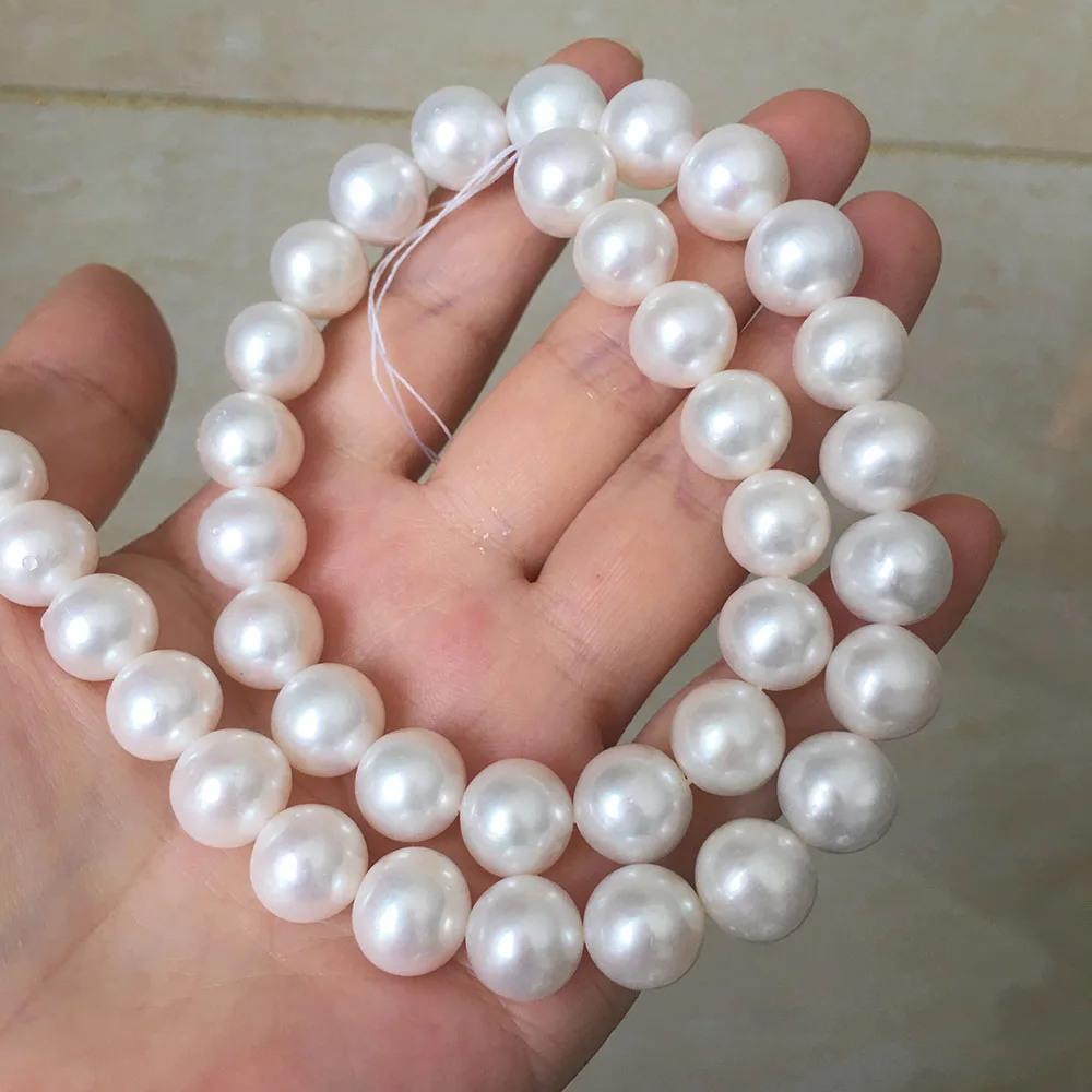 10.5-11.5 mm AA+ good quality round shape pearl in strand high luster loose wholesale freshwater pearl small flaw