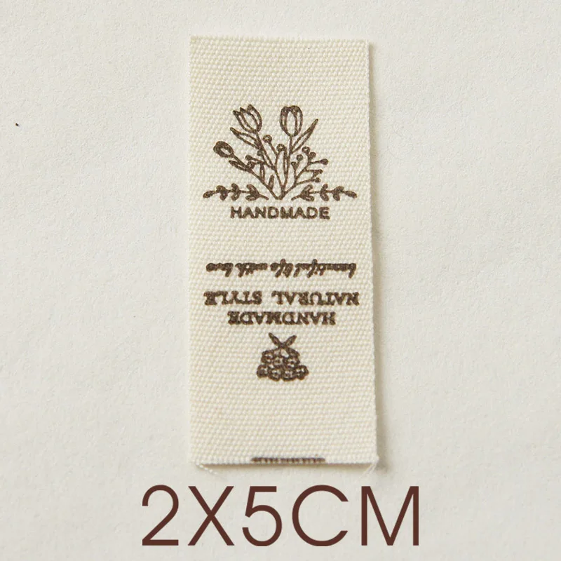 Hand-folded spot shipping mark head tulip bouquet smiling face cloth label accessories sewing DIY side label.
