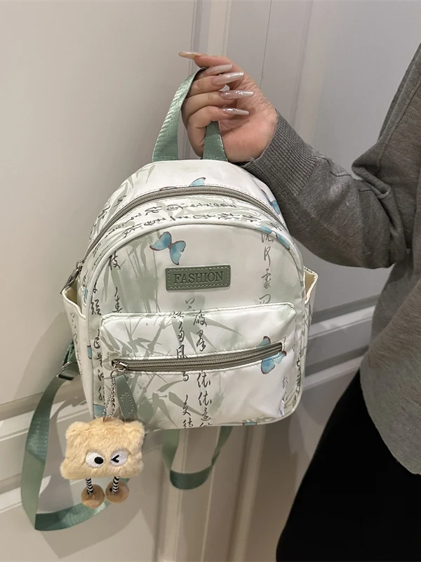 mochila-com-estampa-de-borboleta-estilo-coreano-versao-2026-bolsa-de-ombro-de-lona-macia-para-jovens