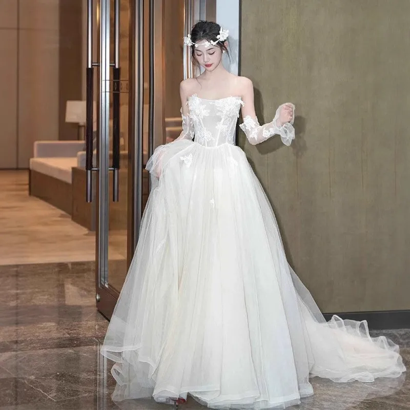 

lace light strapless small tail wedding dress for welcoming guests and travel photography