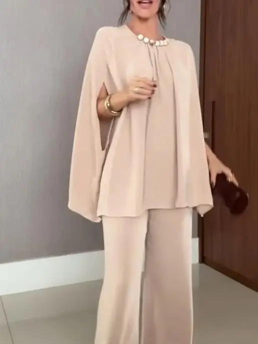 Zestaw damski: elegancki top z okrągłym dekoltem, rękawami typu nietoperz i luźnym krojem, zdobiony perłami w jednolitym kolorze, oraz spodnie z szerokimi nogawkami – stylowy komplet na rok 2025.