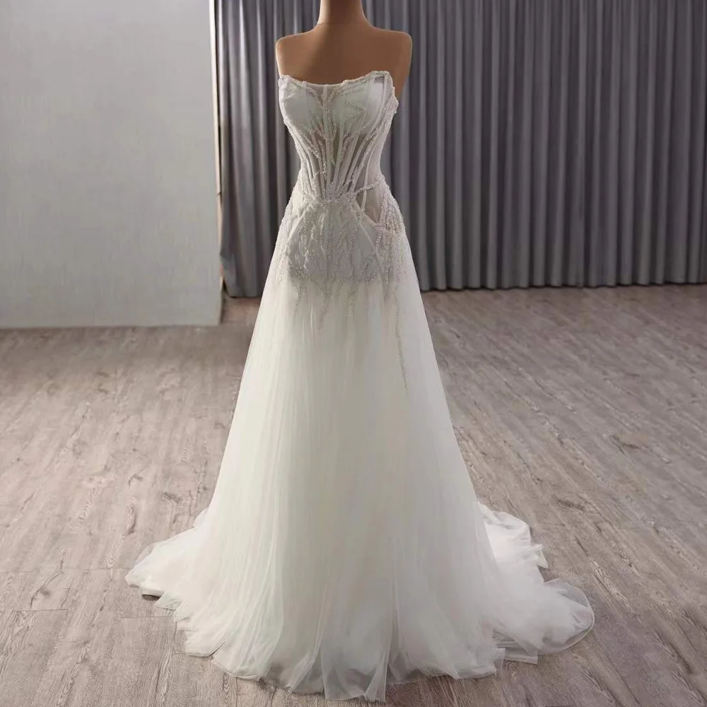 فستان زفاف من Fساتين زفاف بدون حمالات مطرز بالكريستال بدون أكمام وأربطة من الخلف فستان زفاف مثير