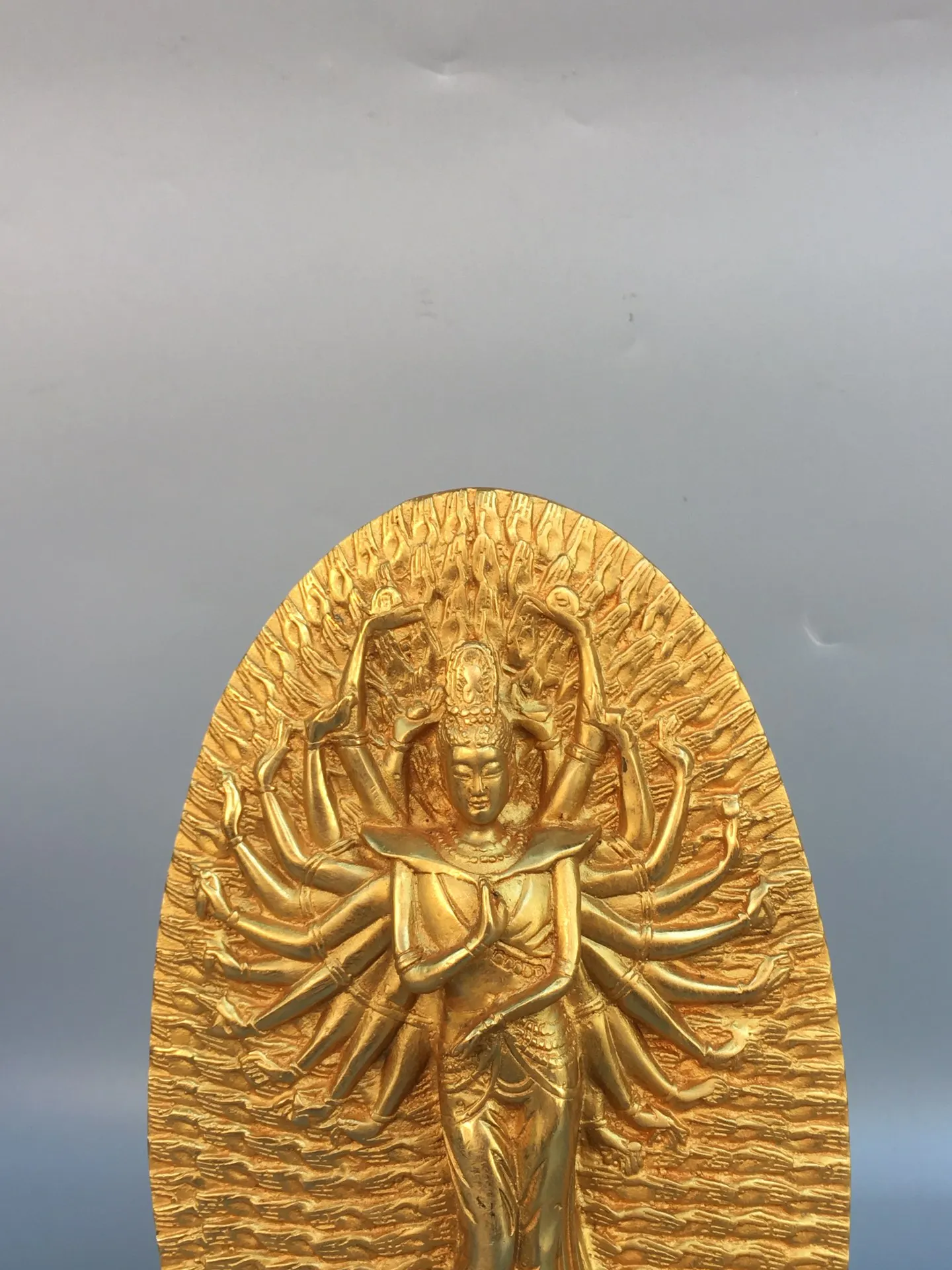 A finely crafted gilt bronze statue of the Thousand-Armed Guanyin Bodhisattva, with a well-developed patina.,Free shipping